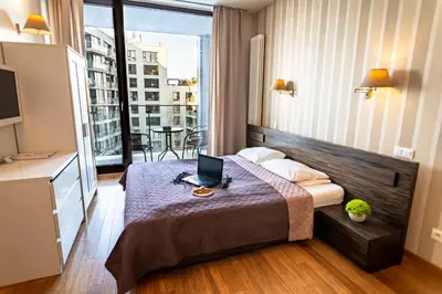 Łóżko lub łóżka w pokoju w obiekcie Triton Apartments