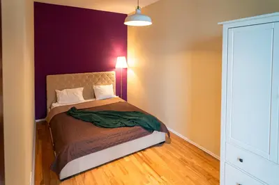 Łóżko lub łóżka w pokoju w obiekcie Triton Apartments