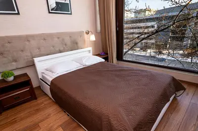 Łóżko lub łóżka w pokoju w obiekcie Triton Apartments