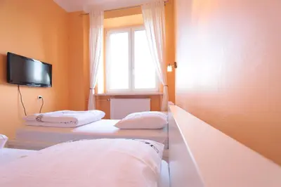 Łóżko lub łóżka w pokoju w obiekcie Warsaw City Apartments