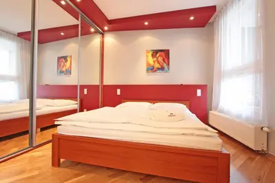 Łóżko lub łóżka w pokoju w obiekcie Warsaw City Apartments