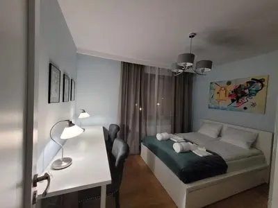 Łóżko lub łóżka w pokoju w obiekcie Warsaw Praga Apartment