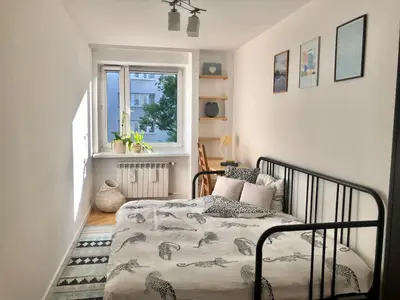 Łóżko lub łóżka w pokoju w obiekcie Comfortable and cosy apartment 3 beds-city center