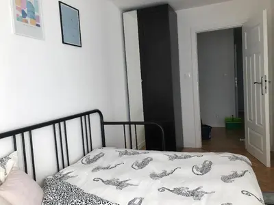 Łóżko lub łóżka w pokoju w obiekcie Comfortable and cosy apartment 3 beds-city center