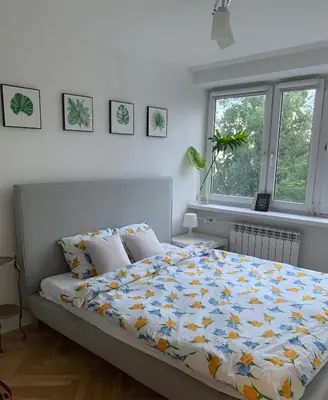 Łóżko lub łóżka w pokoju w obiekcie Comfortable and cosy apartment 3 beds-city center