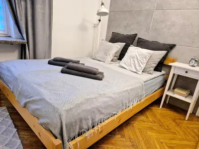 Łóżko lub łóżka w pokoju w obiekcie Apartament Miodowa Warszawa