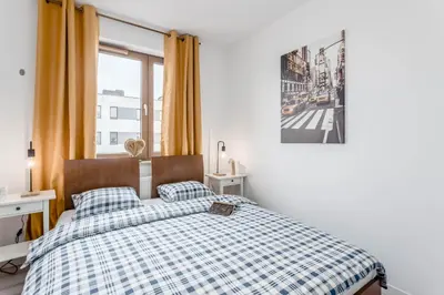 Łóżko lub łóżka w pokoju w obiekcie Chill Apartments Praga Południe