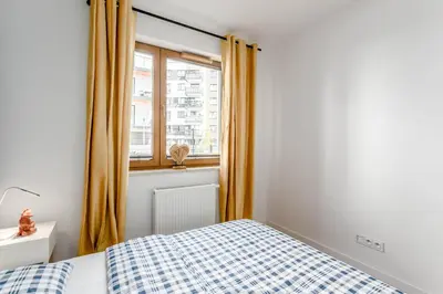 Łóżko lub łóżka w pokoju w obiekcie Chill Apartments Praga Południe