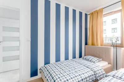 Łóżko lub łóżka w pokoju w obiekcie Chill Apartments Praga Południe