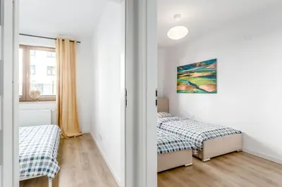 Łóżko lub łóżka w pokoju w obiekcie Chill Apartments Praga Południe