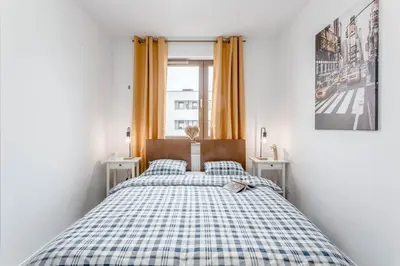 Łóżko lub łóżka w pokoju w obiekcie Chill Apartments Praga Południe