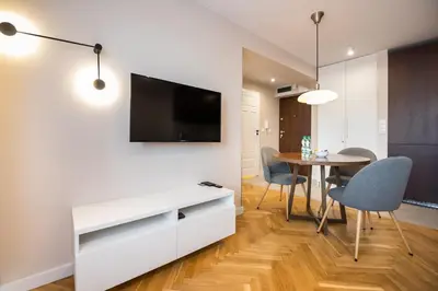 Telewizja i/lub zestaw kina domowego w obiekcie Powiśle Chic Apartment by BookingHost