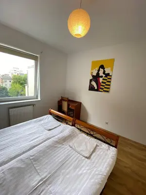 Łóżko lub łóżka w pokoju w obiekcie Murano Apartaments Nova Praga