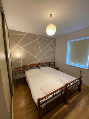 Łóżko lub łóżka w pokoju w obiekcie Murano Apartaments Nova Praga