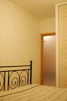 Łóżko lub łóżka w pokoju w obiekcie Apartament Bobrowiecka