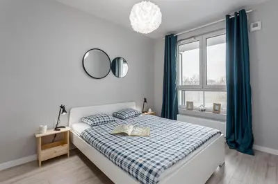 Łóżko lub łóżka w pokoju w obiekcie Chill Apartments Ursus