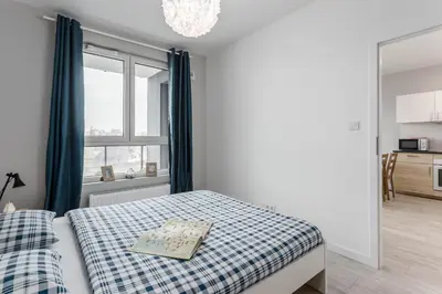 Łóżko lub łóżka w pokoju w obiekcie Chill Apartments Ursus