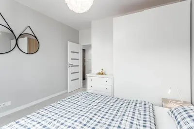 Łóżko lub łóżka w pokoju w obiekcie Chill Apartments Ursus