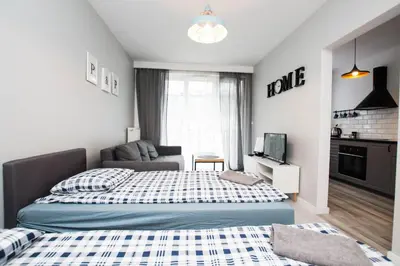 Łóżko lub łóżka w pokoju w obiekcie WAW Apartamenty Cybernetyki