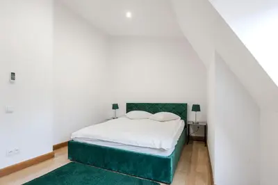 Łóżko lub łóżka w pokoju w obiekcie 1898 Suite