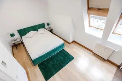 Łóżko lub łóżka w pokoju w obiekcie 1898 Suite