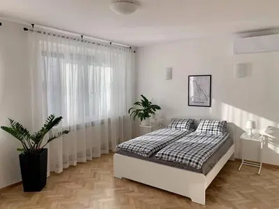 Łóżko lub łóżka w pokoju w obiekcie Apartment Mokotów Wernyhory