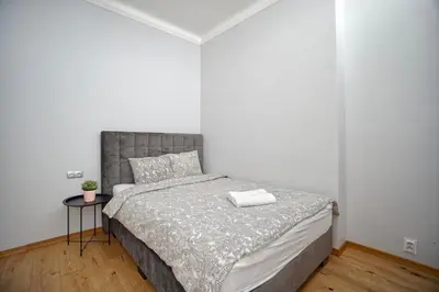 Łóżko lub łóżka w pokoju w obiekcie Warsaw Premium Apartments Deluxe Old Town