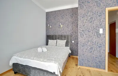 Łóżko lub łóżka w pokoju w obiekcie Warsaw Premium Apartments Deluxe Old Town