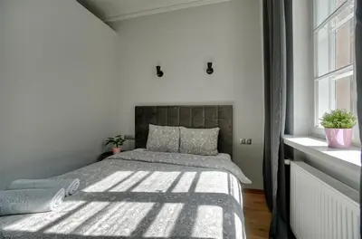 Łóżko lub łóżka w pokoju w obiekcie Warsaw Premium Apartments Deluxe Old Town