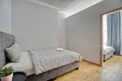 Łóżko lub łóżka w pokoju w obiekcie Warsaw Premium Apartments Deluxe Old Town