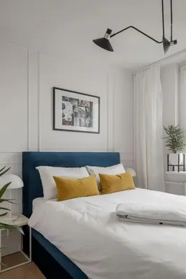 Łóżko lub łóżka w pokoju w obiekcie Stylowy apartament przy metrze
