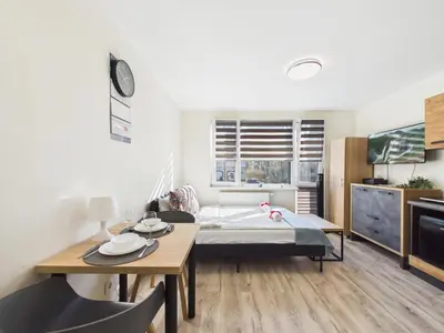 Łóżko lub łóżka w pokoju w obiekcie SuperApart Batorego 18 MiniStudio - Blisko SGH i Centrum