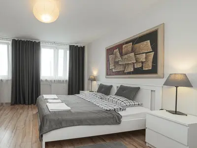 Łóżko lub łóżka w pokoju w obiekcie Sliska 10 Apartament II