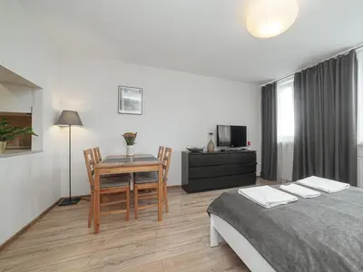 Łóżko lub łóżka w pokoju w obiekcie Sliska 10 Apartament II