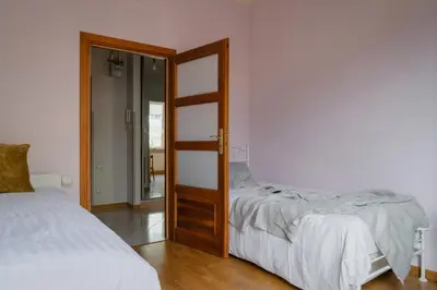 Łóżko lub łóżka w pokoju w obiekcie Warsaw Concierge Racławicka