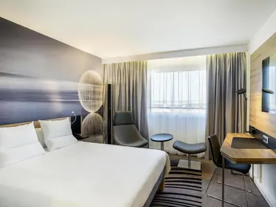 Łóżko lub łóżka w pokoju w obiekcie Novotel Warszawa Airport