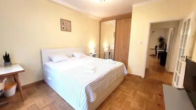 Łóżko lub łóżka w pokoju w obiekcie Happy Life - apartment next to metro station