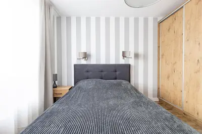 Łóżko lub łóżka w pokoju w obiekcie Fajny apartament z parkingiem, obok metra.
