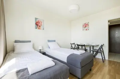 Łóżko lub łóżka w pokoju w obiekcie Labo Apartment Żelazna Brama