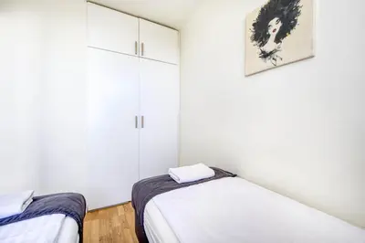 Łóżko lub łóżka w pokoju w obiekcie Labo Apartment Żelazna Brama