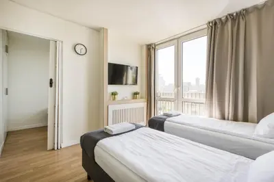 Łóżko lub łóżka w pokoju w obiekcie Labo Apartment Żelazna Brama