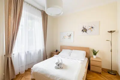 Łóżko lub łóżka w pokoju w obiekcie P&O Serviced Apartments Plac Konstytucji