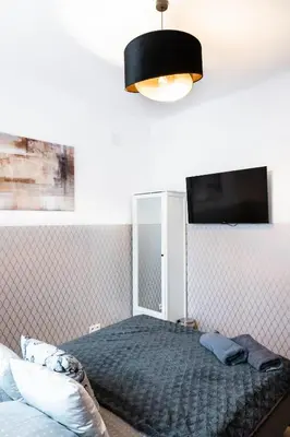 Łóżko lub łóżka w pokoju w obiekcie ClickTheFlat Royal Route Warecka Apart Rooms