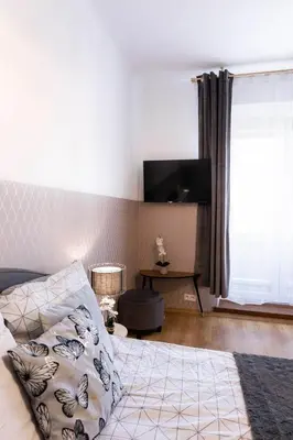 Łóżko lub łóżka w pokoju w obiekcie ClickTheFlat Royal Route Warecka Apart Rooms