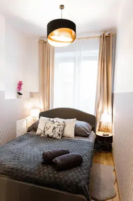 Łóżko lub łóżka w pokoju w obiekcie ClickTheFlat Royal Route Warecka Apart Rooms