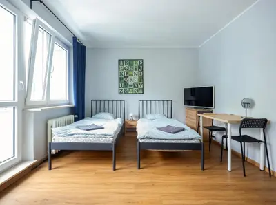 Łóżko lub łóżka w pokoju w obiekcie WAW Pokoje Ursynów