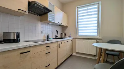 Kuchnia lub aneks kuchenny w obiekcie Ursus Pleasant Apartment by BookingHost