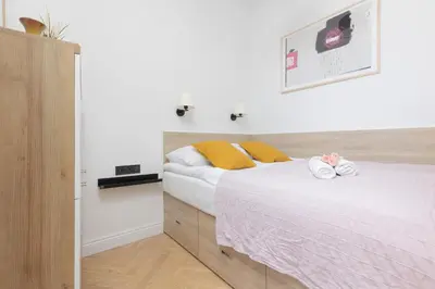 Łóżko lub łóżka w pokoju w obiekcie Apartment Warsaw Mokotów Św Boboli by Noclegi Renters