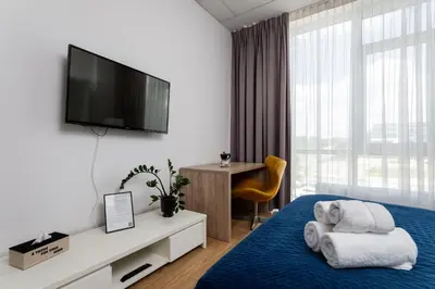 Łóżko lub łóżka w pokoju w obiekcie ALE Jerozolimskie Varsovia Apartments