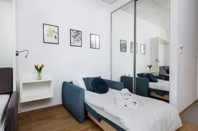 Łóżko lub łóżka w pokoju w obiekcie ALE Jerozolimskie Varsovia Apartments